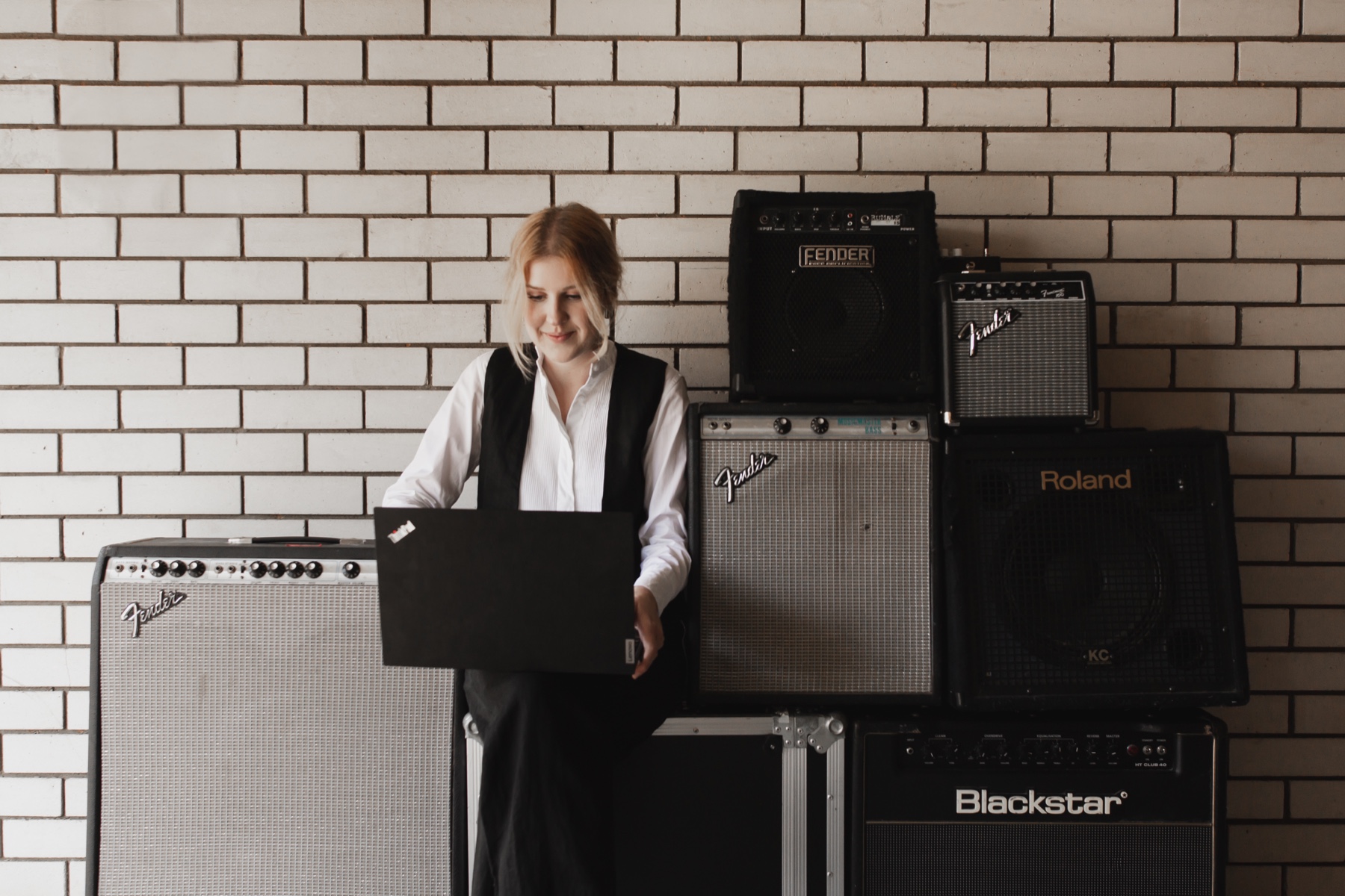 Yvette working at her laptop in the Merivale Studios shipping container